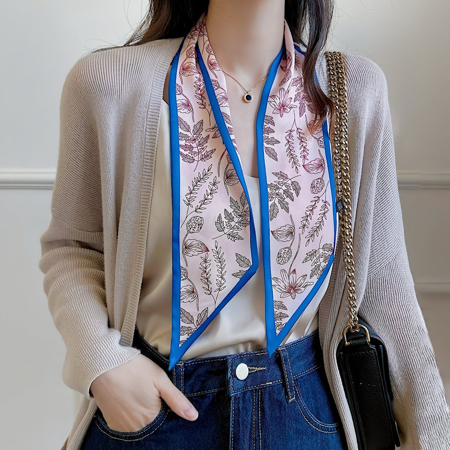 Model wearing a silk scarf in blue, easy for weekend styling and gifting.