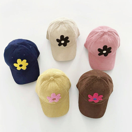 Cordmütze mit Plüschblumen