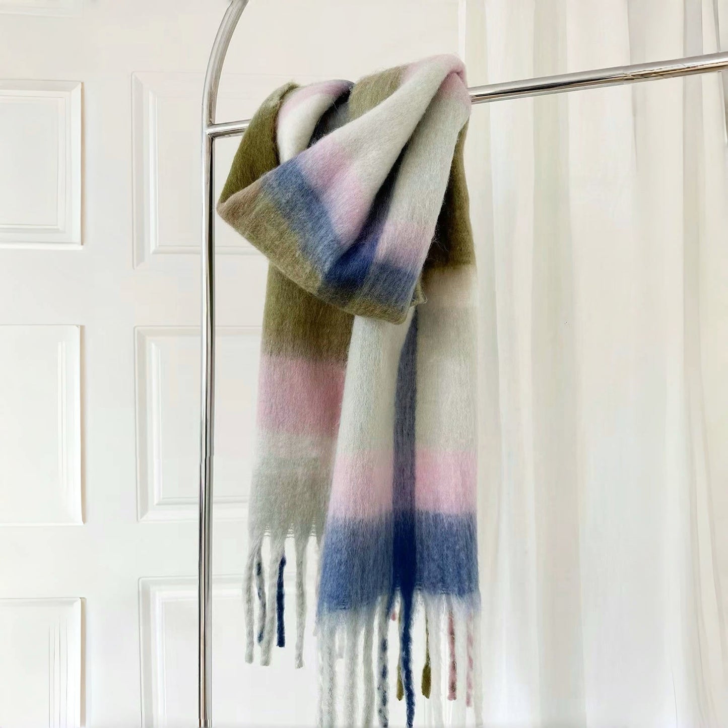 Flat lay of Cloudy Pastel Scarf, great for office layering and commuting.