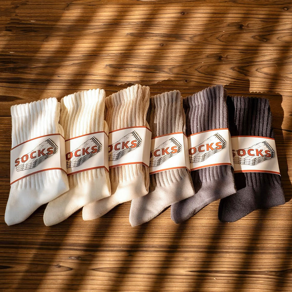 Angled view of 6 pairs of Cotton Slouch Socks, great for daily wear and lounging.
