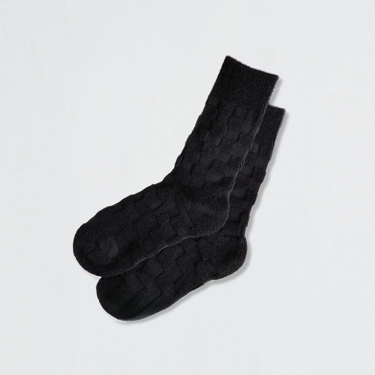 Close-up of Fuzzy Check Textured Socks in black, great for daily wear and lounging.