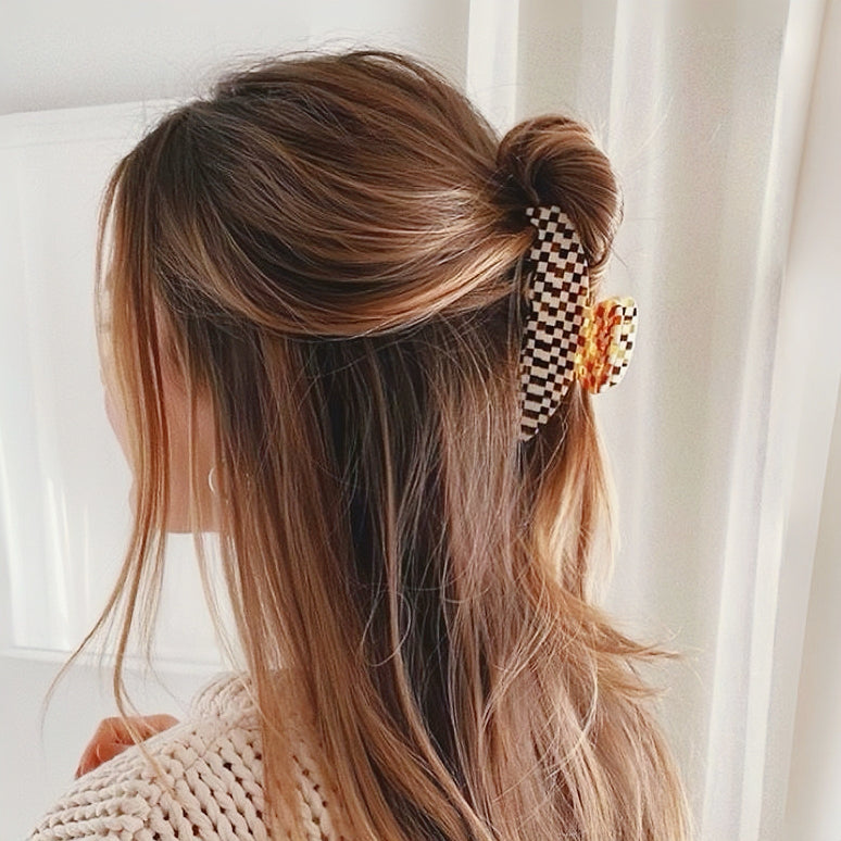 Model wearing a Gentle Curve Hair Claw in brown, ideal for everyday outfits and office looks.