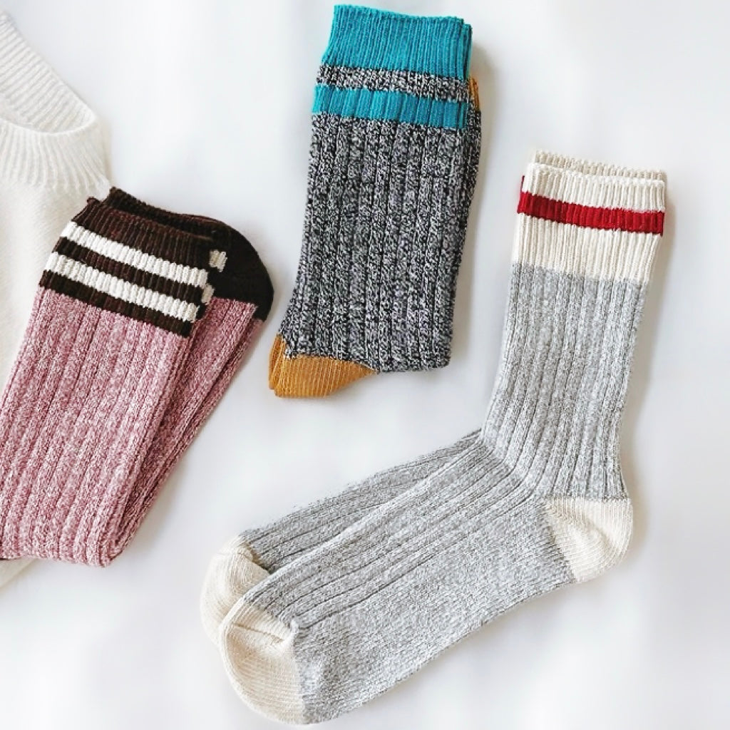 Folded view of three colos of London Time Knitted Socks, ideal for workouts and commuting.