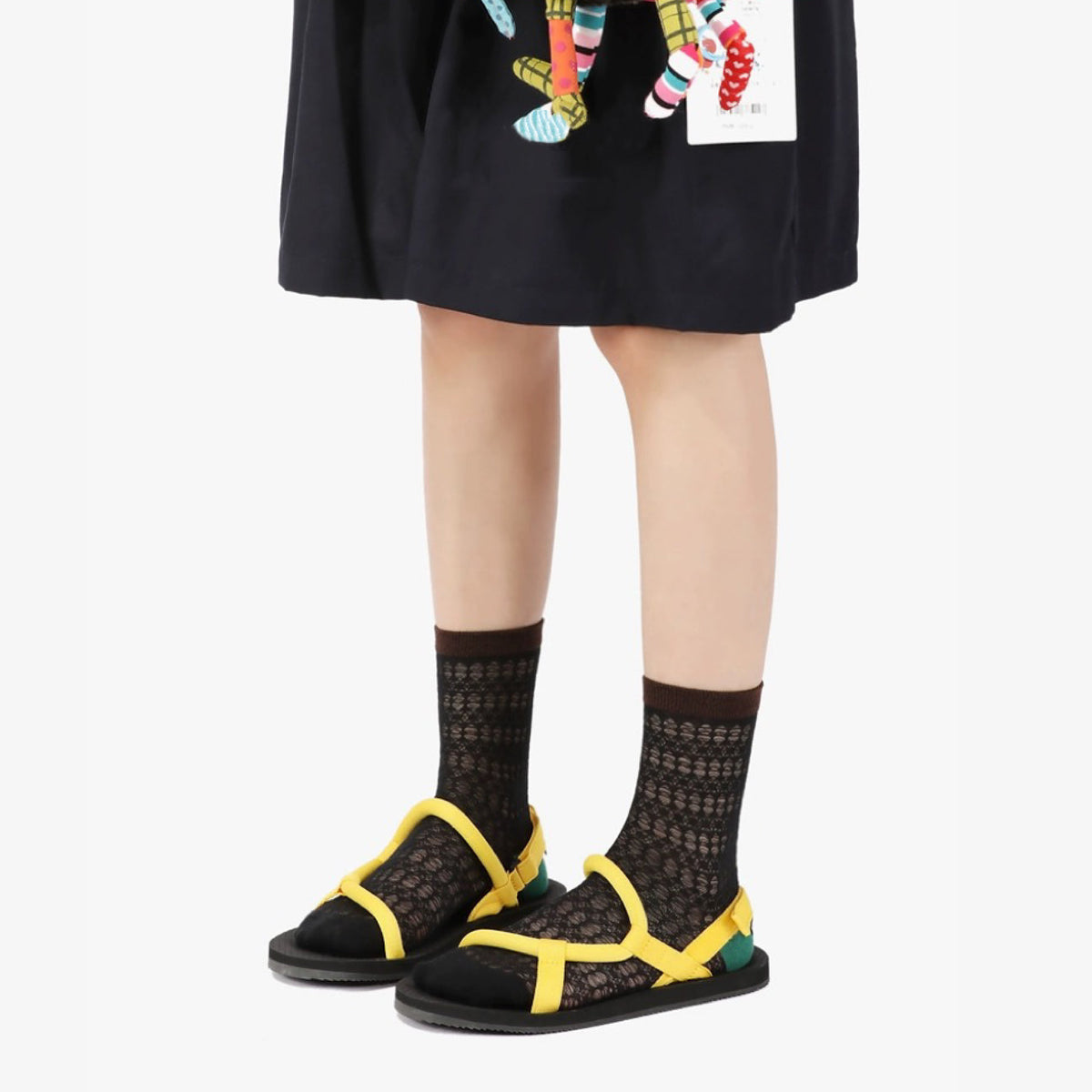 Model wearing a pair of black cotton socks, easy for travel days and daily comfort.