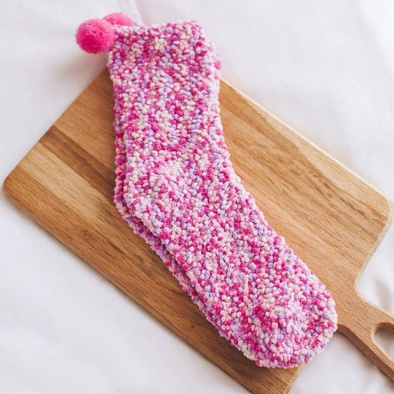 Close-up of Pompom Cupcake Socks in magenta socks, great for daily wear and lounging.