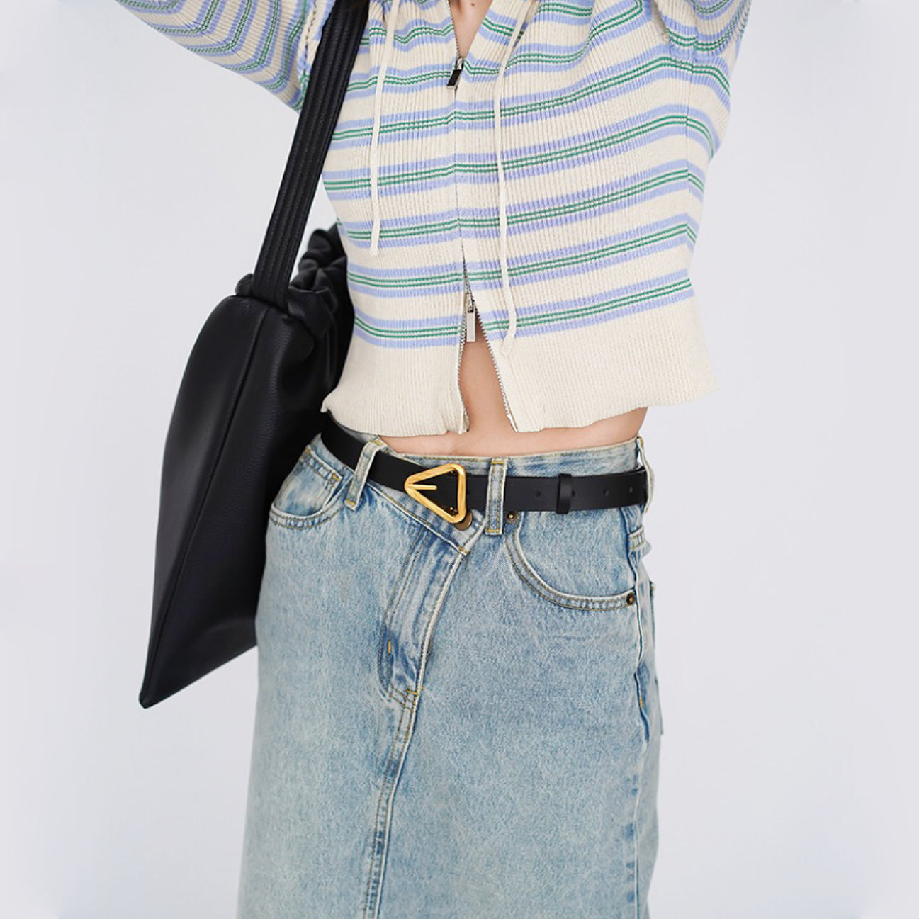 Model styling the black Spiral Triangle Belt, stylish design for daily wear