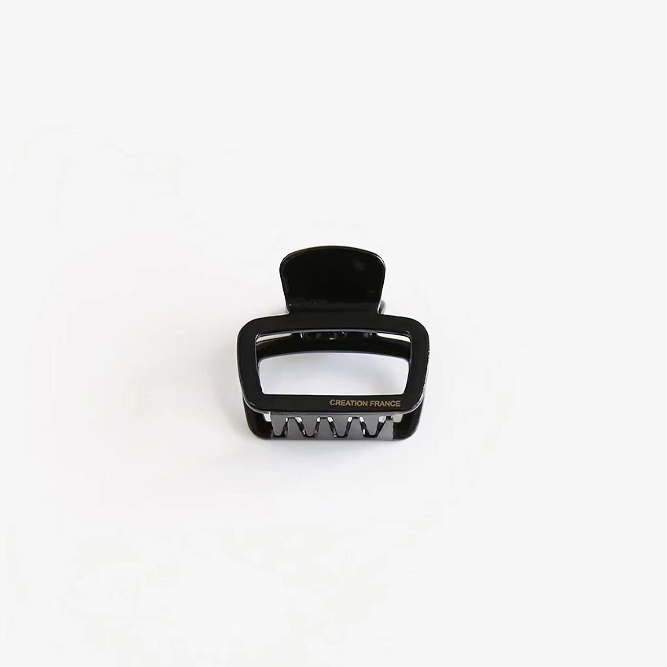 Classic glossy black square hair clip, minimalist and timeless gear for versatile daily hair styling.