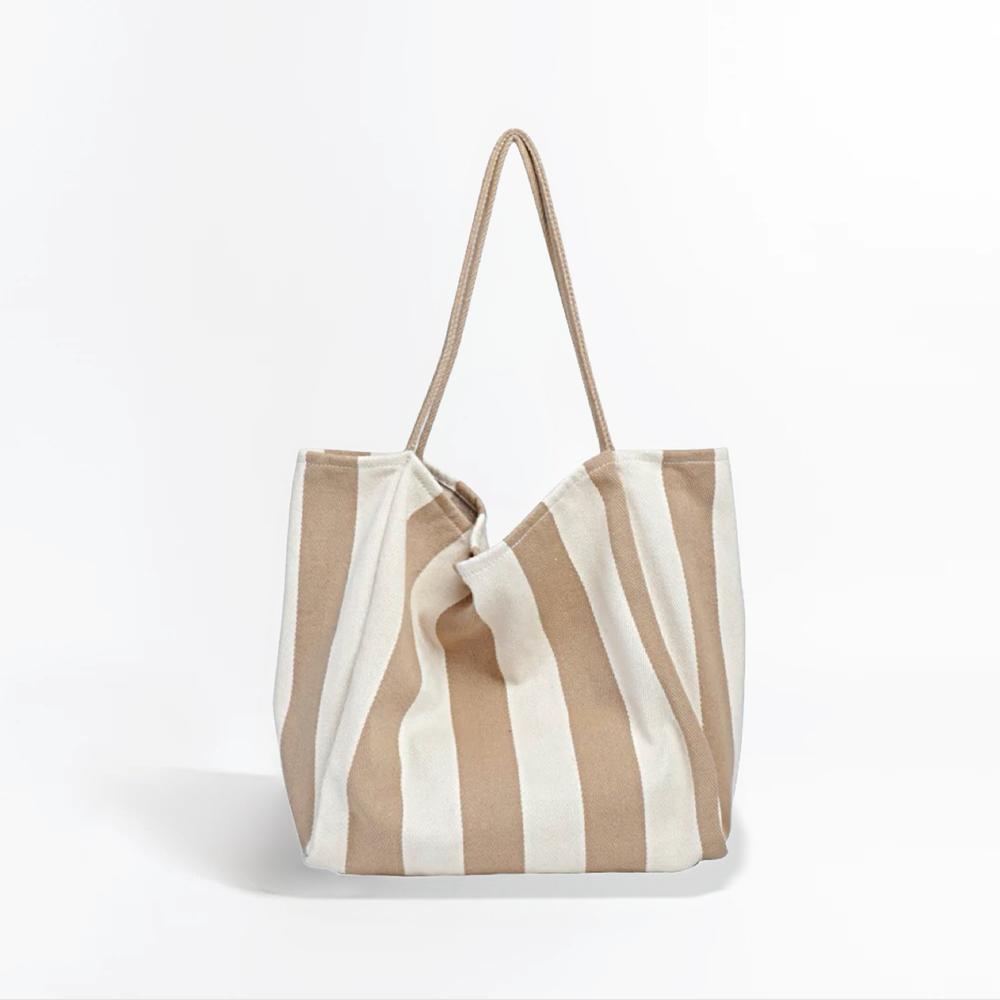 Folded view of Wide Stripe Canvas Tote in khaki, great for everyday carry and travel.