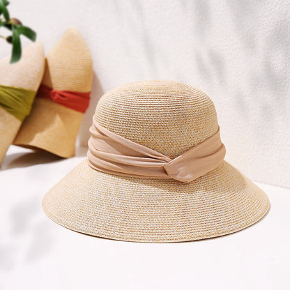 Sun protective foldable straw hat with ribbon