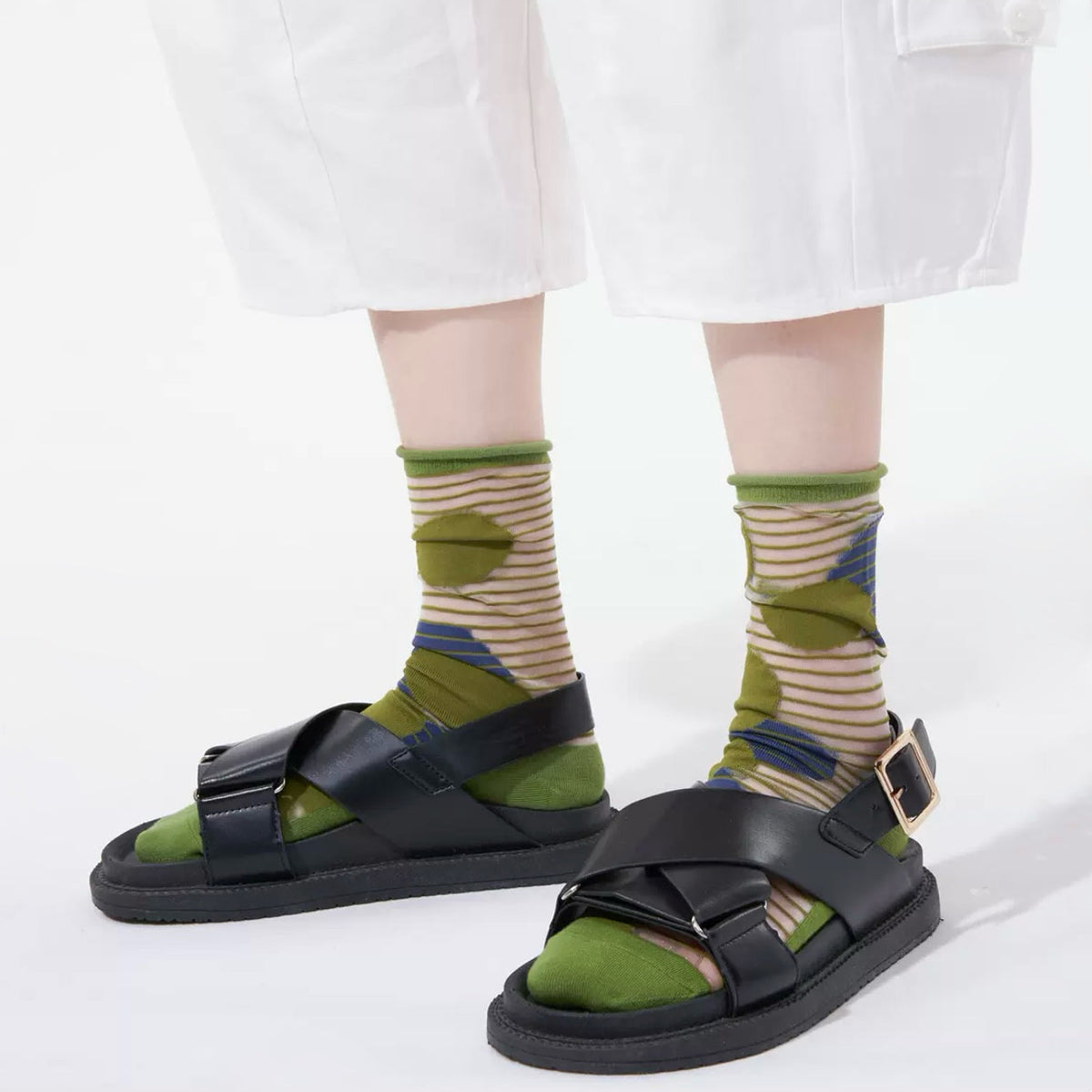 Model wearing a pair of Abstract Pattern Crystal Socks with green bubbles, ideal for workouts and commuting.
