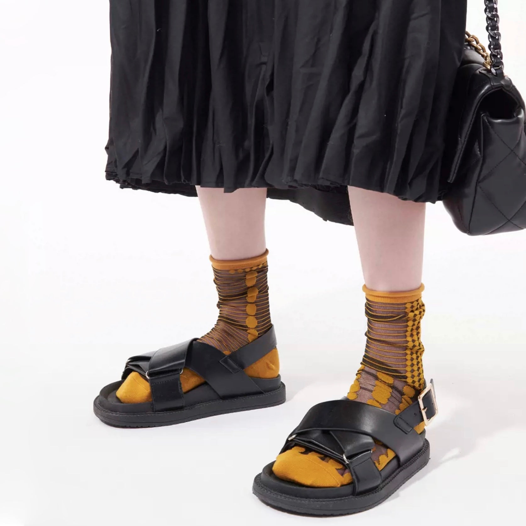 Model wearing a pair of  Abstract Pattern Crystal Socks with golden dots, ideal for everyday outfits and sneakers.