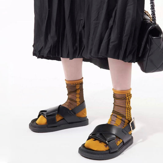Model wearing a pair of  Abstract Pattern Crystal Socks with golden dots, ideal for everyday outfits and sneakers.