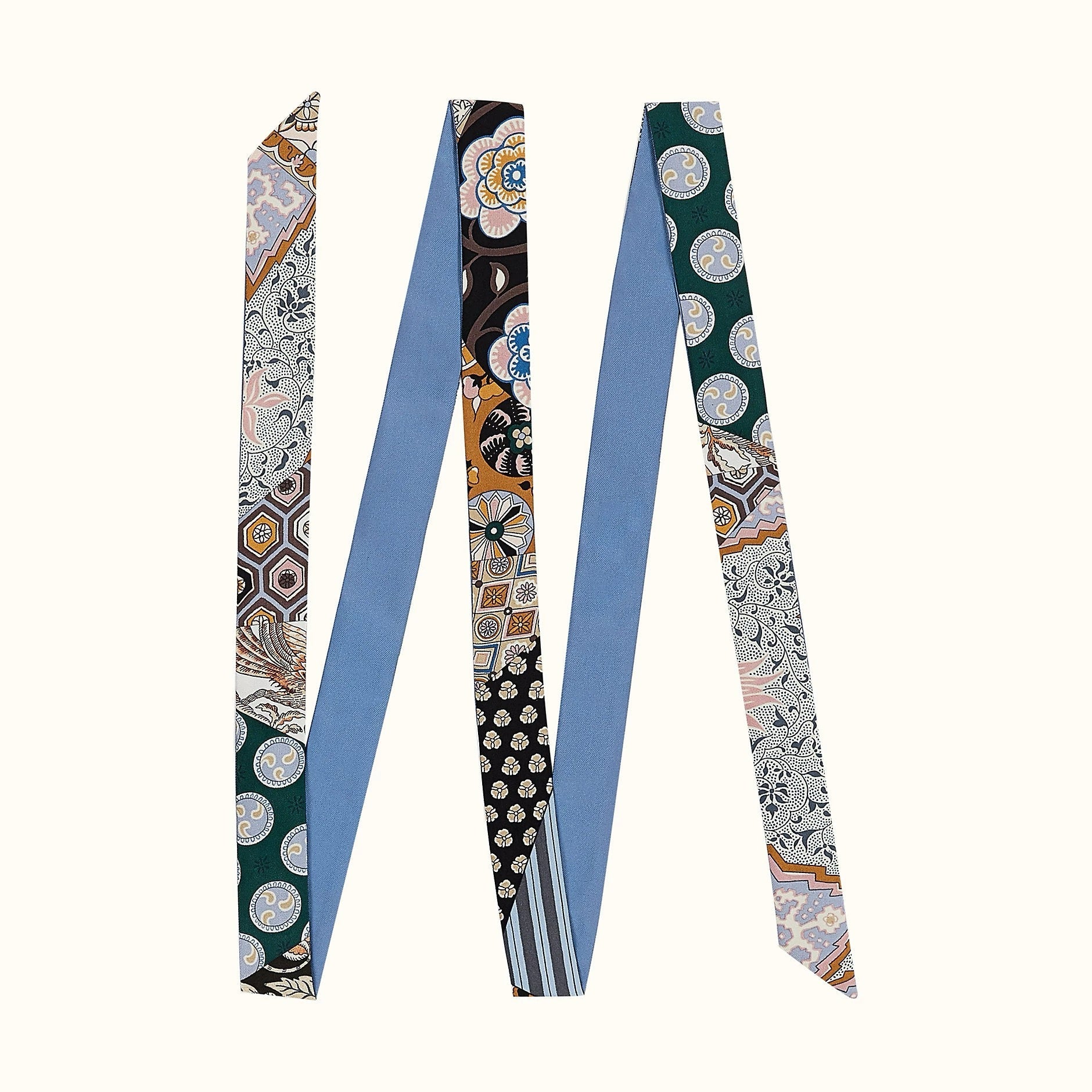 Angled view of Artistic Print Skinny Scarf in blue, great for office layering and commuting.