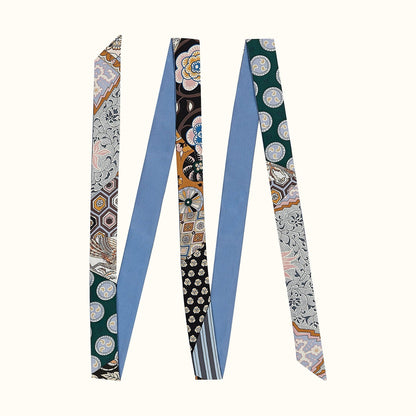 Angled view of Artistic Print Skinny Scarf in blue, great for office layering and commuting.