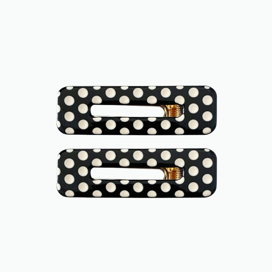 Angled view of Black And White Dot Hair Clips in rectangle shape, easy for workdays and special occasions.