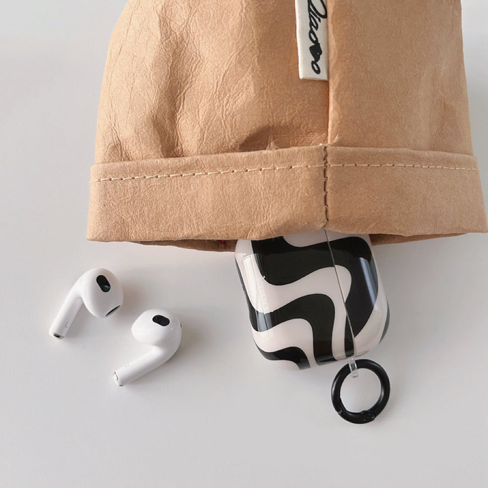 Angled view of Black Wave Airpods Case Cover, easy to carry for commutes and errands.