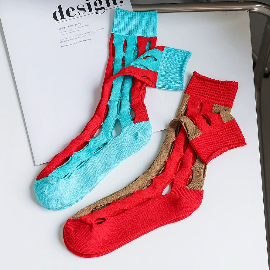 Close-up of 2 pairs of Bold Hollow Socks, one is red-blue and one is red-blue.