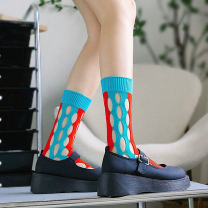Model wearing a pair of blue and red Bold Hollow Socks, great for casual wear and light workouts.