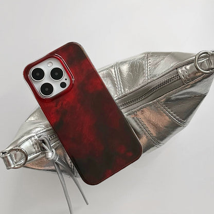 Aesthetic view of Burgundy Flux Case, capturing a sense of modern motion and deep luxurious red tones.