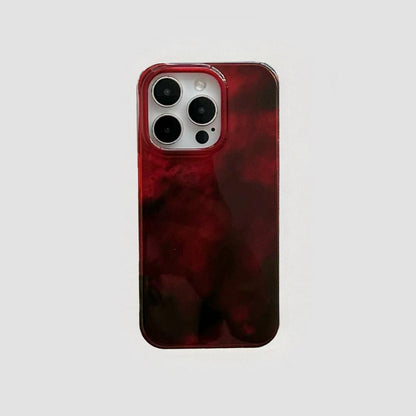 Burgundy acrylic phone case with a swirled flux design. Sophisticated fluid art style with precise camera cutouts.