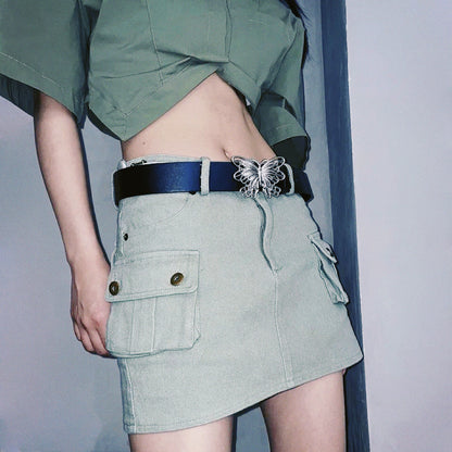 Model styling the black belt with siver butterfly buckle for a chic outfit.
