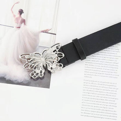 Close-up of the sleek belt with silver metal butterfly buckle.