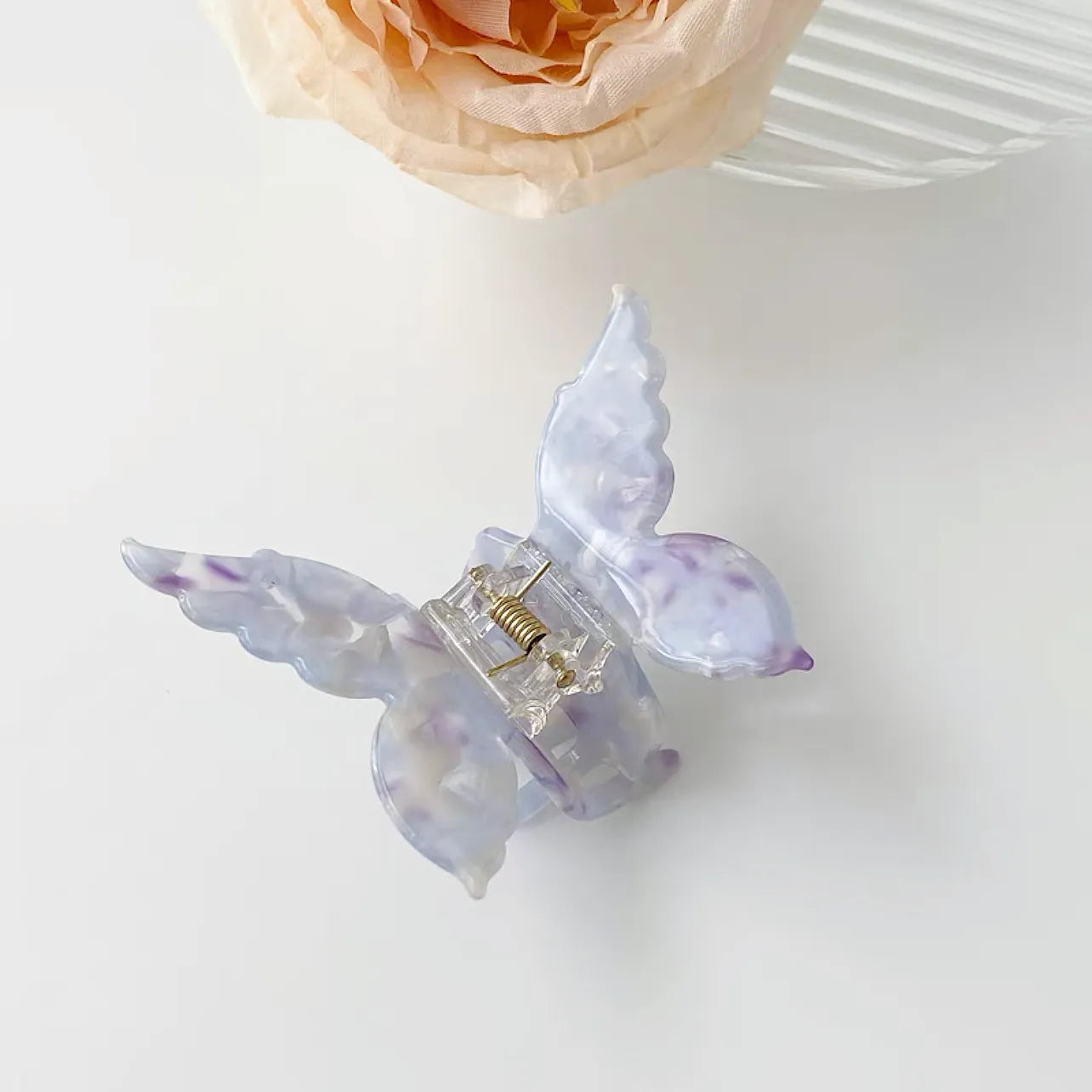 Folded view of butterfly hair claw in purple, ideal for quick updos and ponytails.