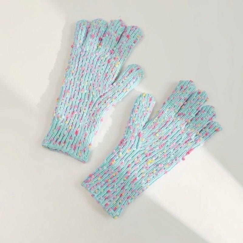 Mint candy-dot knit gloves with bobble dot texture and ribbed cuffs; cozy accessory for chilly weather.