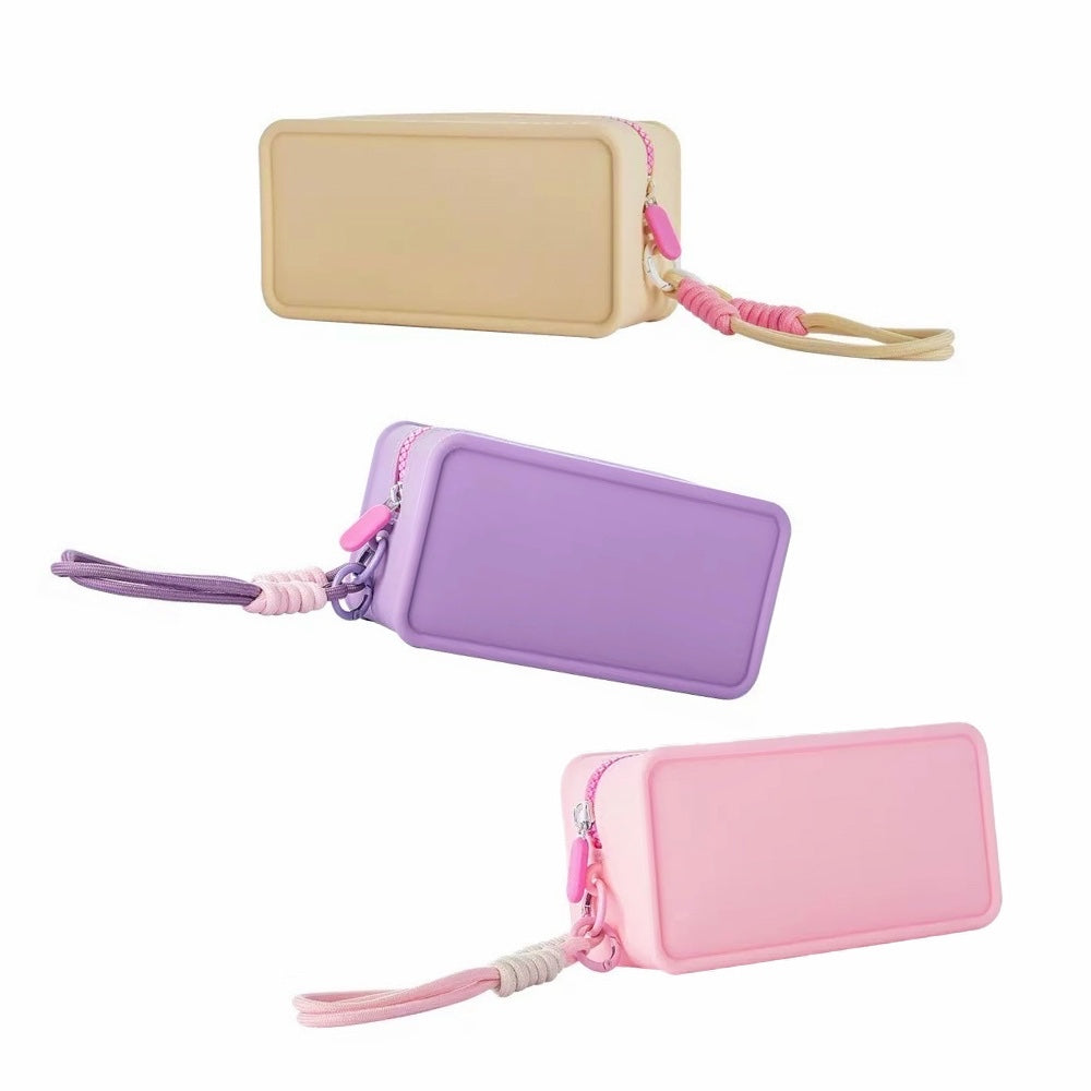 Middle size of purple, khaki and purple silicone makeup organizers arranged flat to show the slim yet flexible profile.