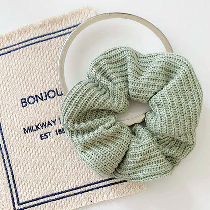 Angled view of Candy Knitted Scrunchie in mint green, great for everyday styling and gifting.