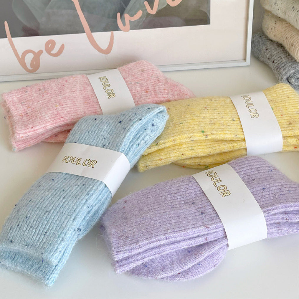 Collection of four candy-colored thick wool socks displayed flat.