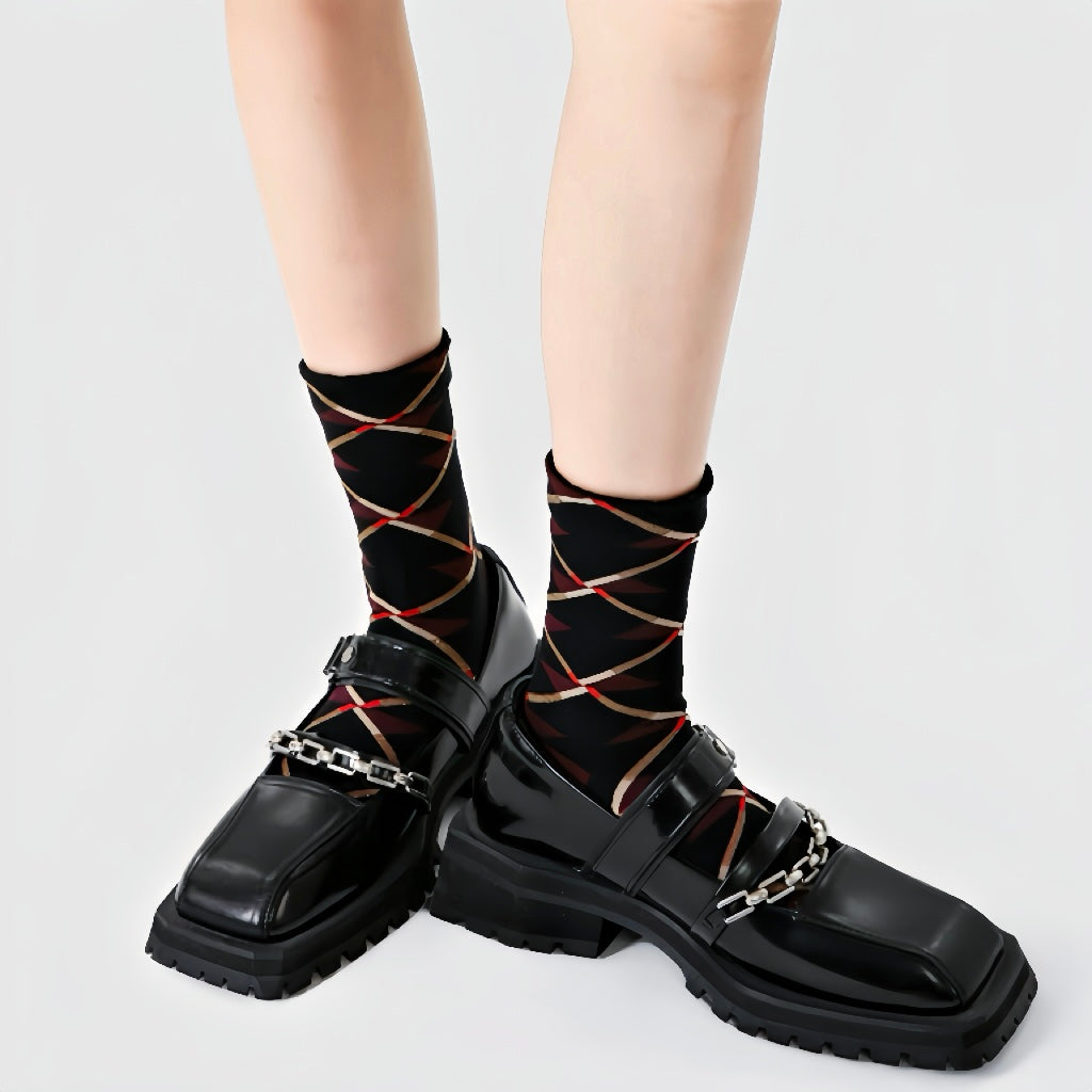 Close-up of Caramel Diamond Socks in black socks, easy to pack for travel and errands.
