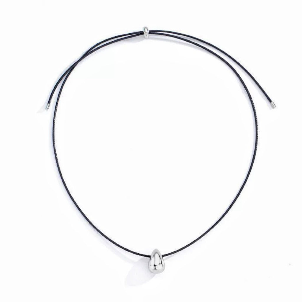 Flat lay of Celestial Drop Pendant Necklace in Silver, premium Jewelry for modern women earrings.