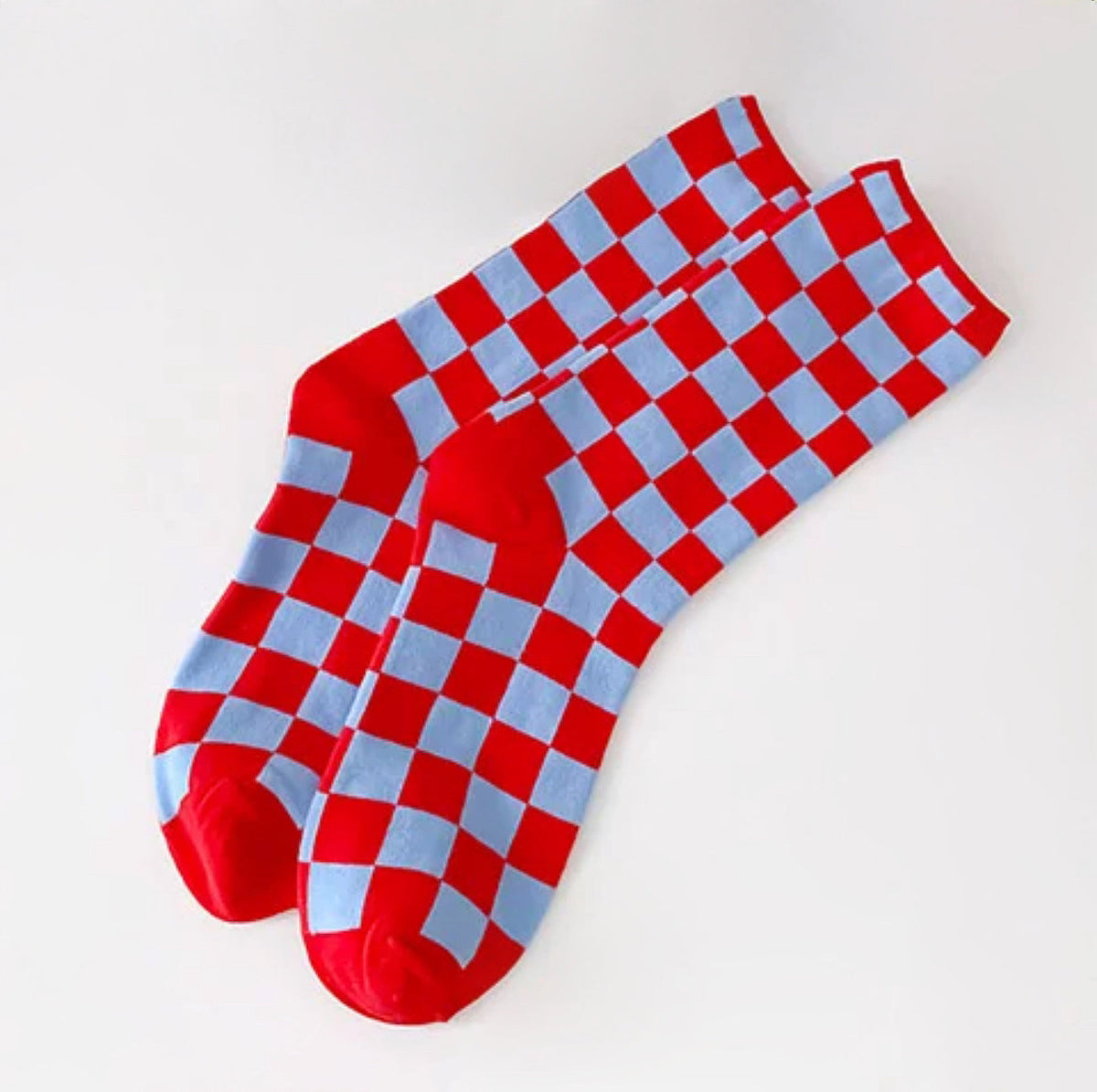 Front view of Checkerboard Colored Socks in red, easy to pack for travel and errands.