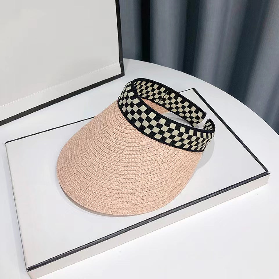 Front view of pink Checkered Band Straw Visor Hat. Stylish summer sun protection for women.