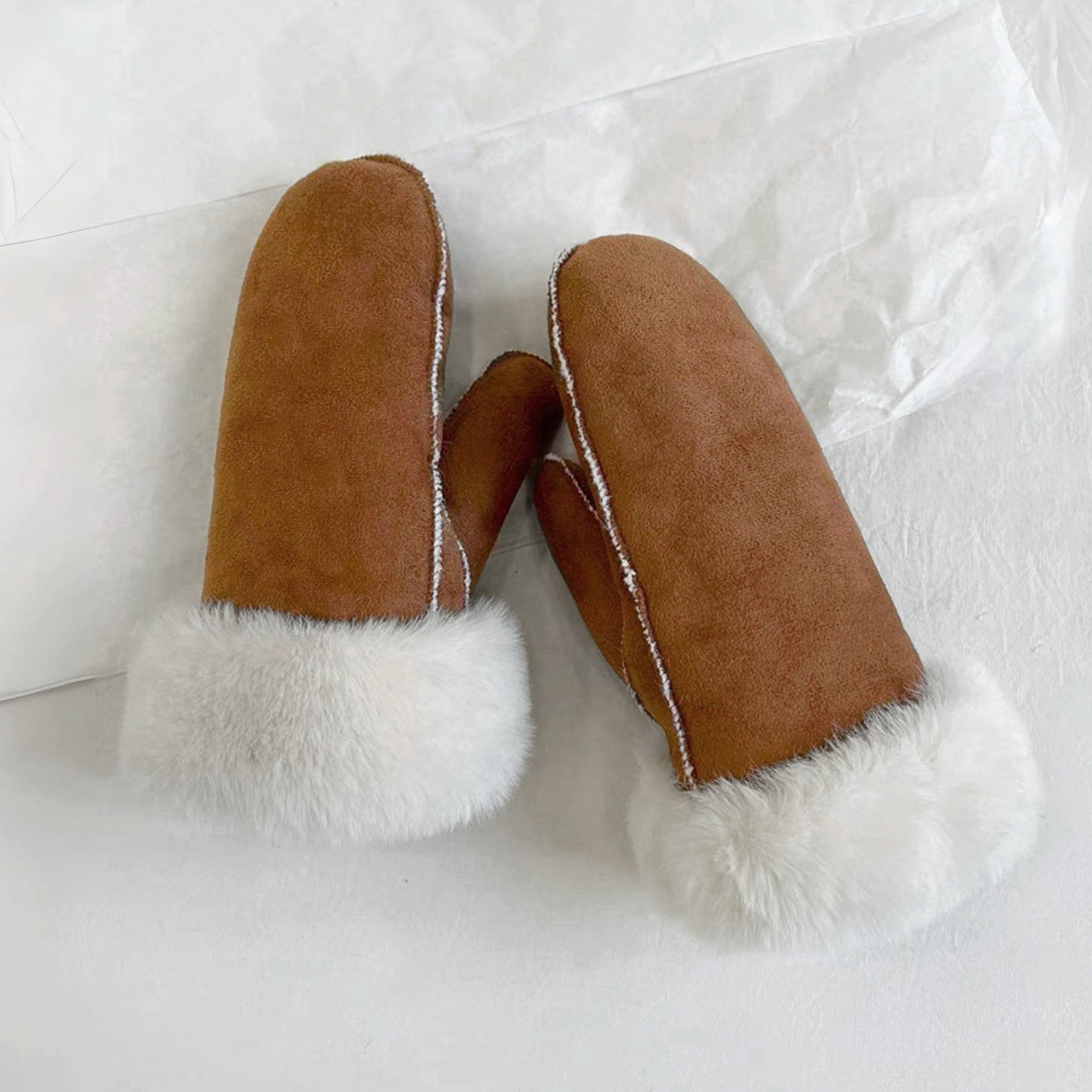 Flat lay chestnut suede gloves, smooth finish with stitched fingers; everyday winter gloves for outdoors.