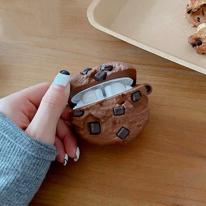 Model Hands holding a brown Chocolate Cookies AirPods case cover, easy to carry for commutes and travel.