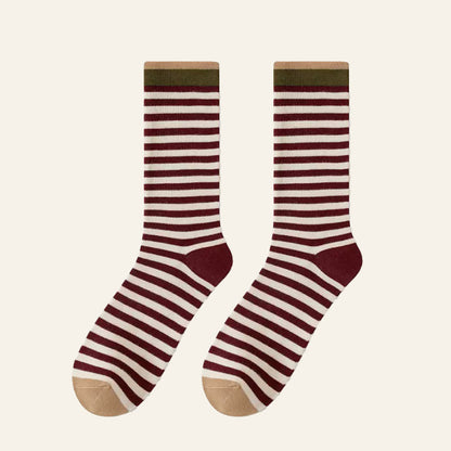 Folded view of Chromatic Stripe Socks in burgundy , ideal for workouts and commuting.