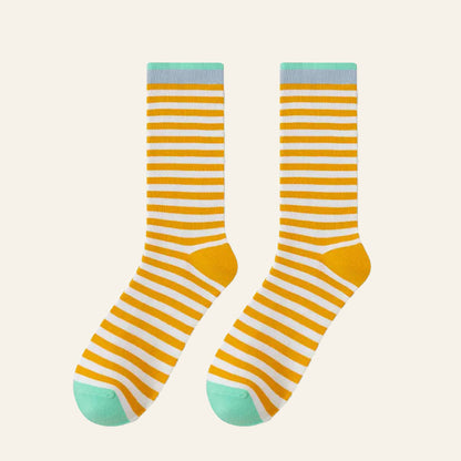 Angled view of Chromatic Stripe Socks in yellow, great for daily wear and lounging.