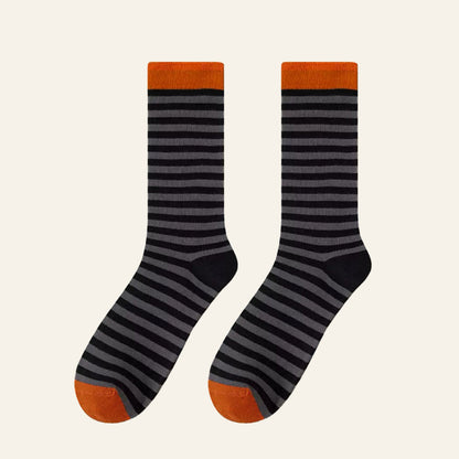 Angled view of Chromatic Stripe Socks in black, easy to pack for travel and errands.