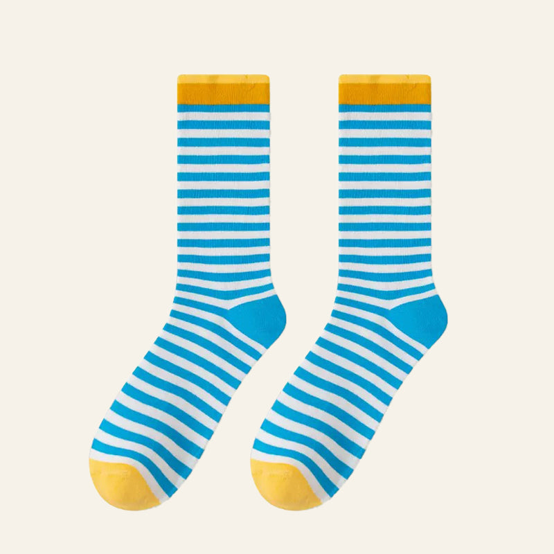 Flat lay of Chromatic Stripe Socks in blue, easy to pack for travel and errands.