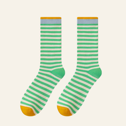 Folded view of Chromatic Stripe Socks in grass green, great for daily wear and lounging.