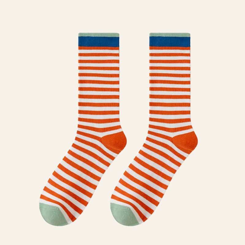 Close-up of Chromatic Stripe Socks in orange, ideal for workouts and commuting.