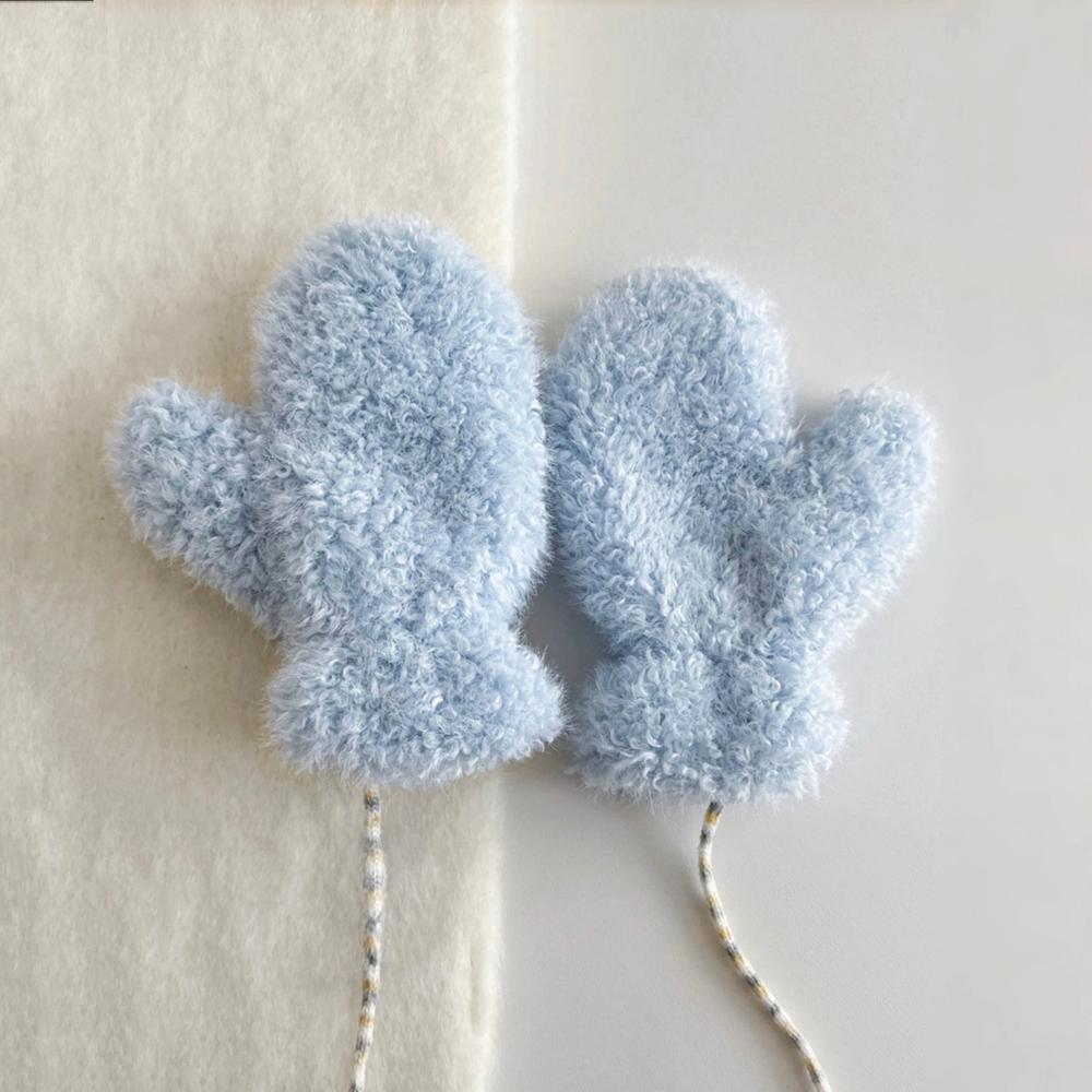 Blue cloud-touch fluffy gloves with soft plush texture; cozy winter accessory for everyday wear.