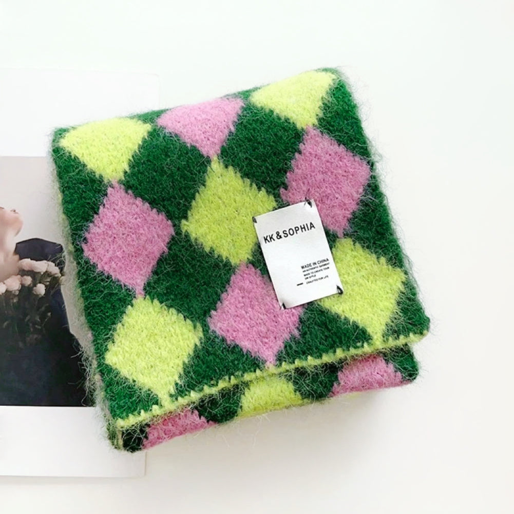 Angled view of Wool-acrylic colorblock diamond scarf in vibrant pink, lime green, and dark green, easy for travel.