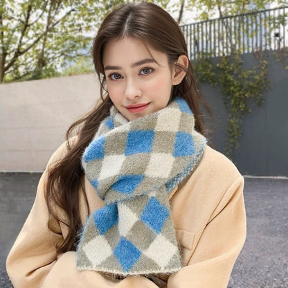 Model wearing a wool scarf in beige and blue, easy for weekend styling and gifting.