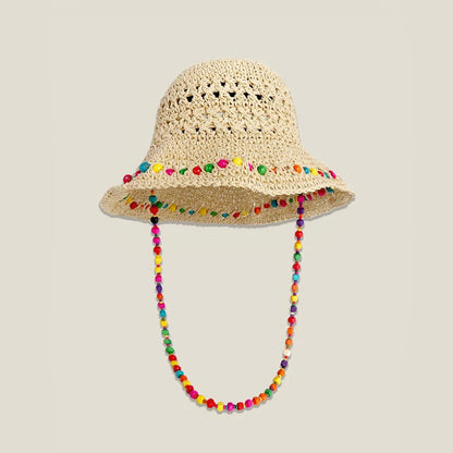 Front view of the beige woven straw hat with a colorful beaded band and hanging cord.