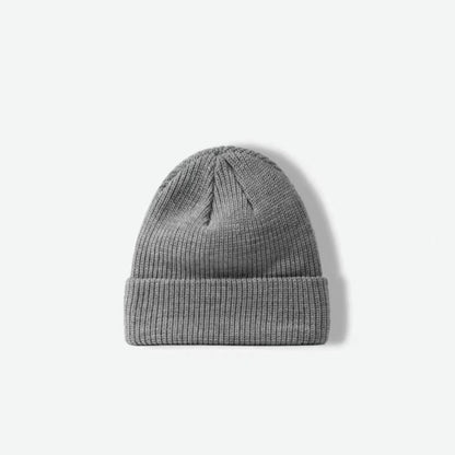 Front view of grey multi-color beanie. Sophisticated neutral flecks for a professional yet cozy aesthetic.