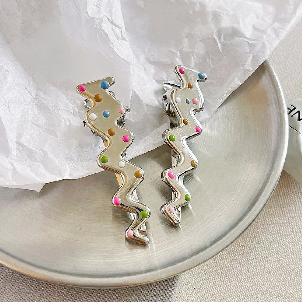 Flat lay of Colorful Polka Dot Hair Clip in lightning shape, great for everyday styling and gifting.