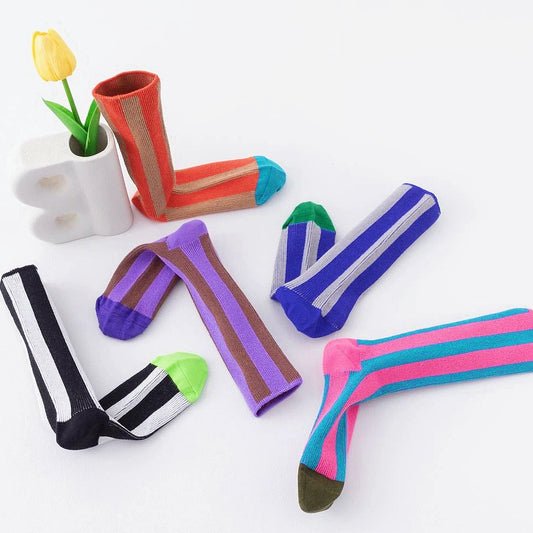 Front view of Five colors of contrast color striped socks in various vibrant hues.